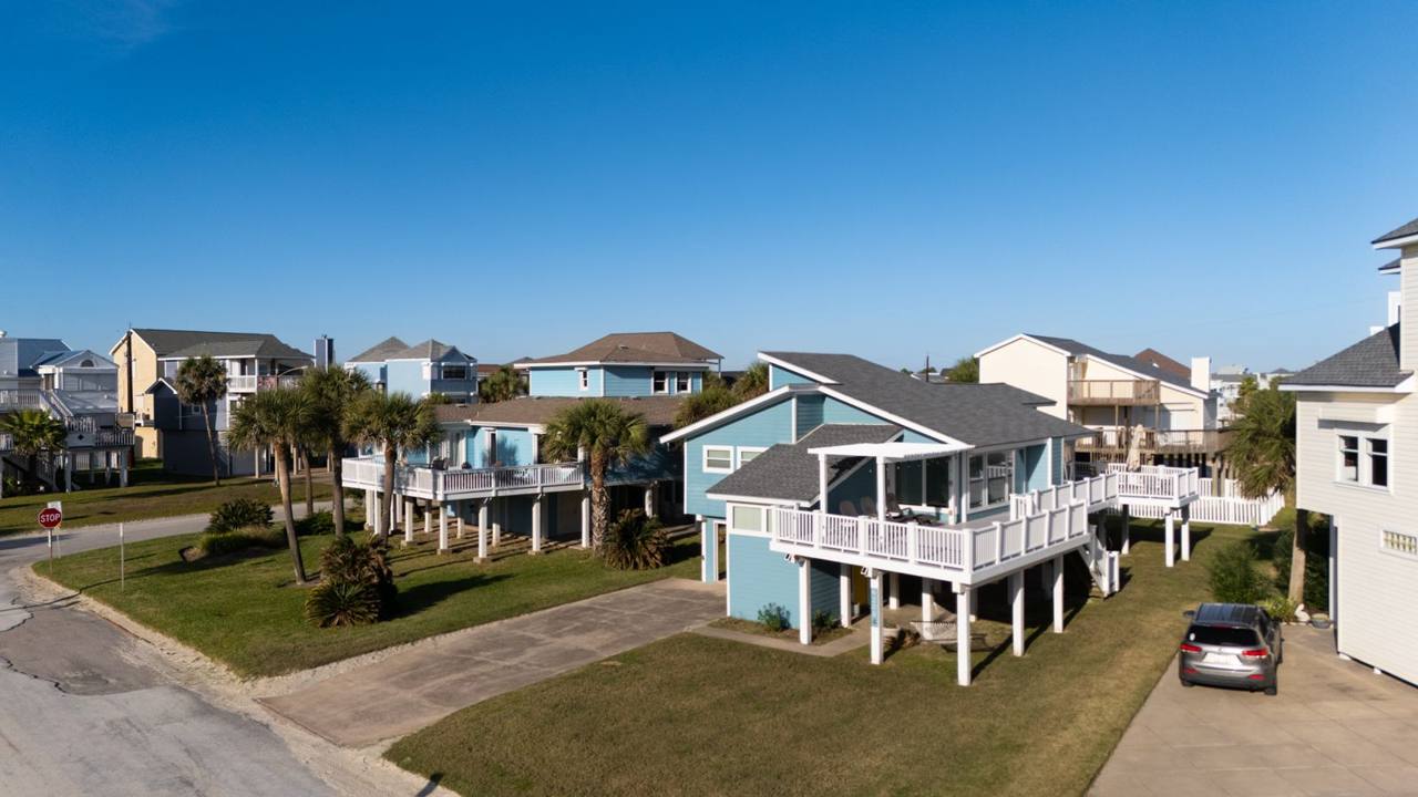 Elevated view of the house and its large deck in the neighborhood