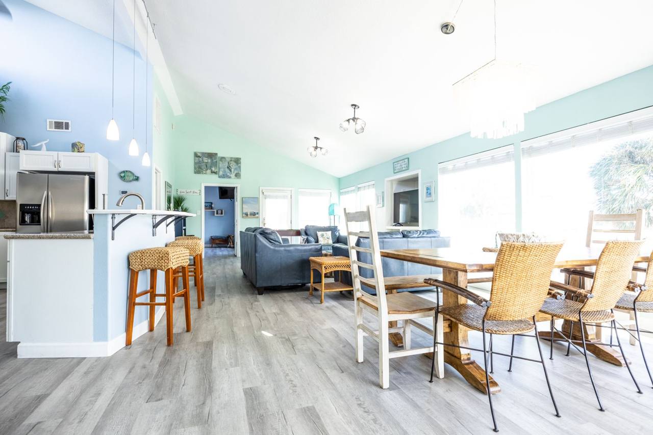 Open kitchen, dining and living area under a vaulted ceiling